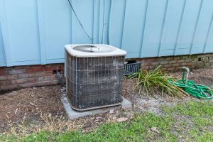 A faulty HVAC unit outside of a building