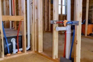 PVC pipe being installed in the construction of a new building