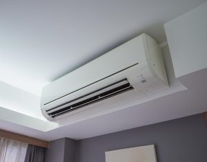 An air conditioning unit inside a hotel room